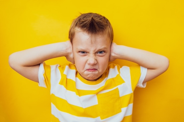 Angry young boy who could benefit from PACE intervention