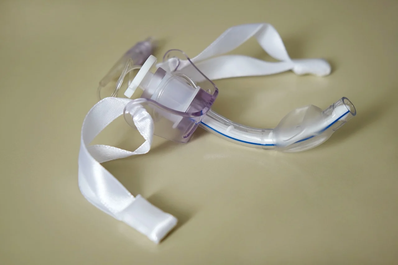 Tracheostomy Tube A tracheostomy tube is on the table.